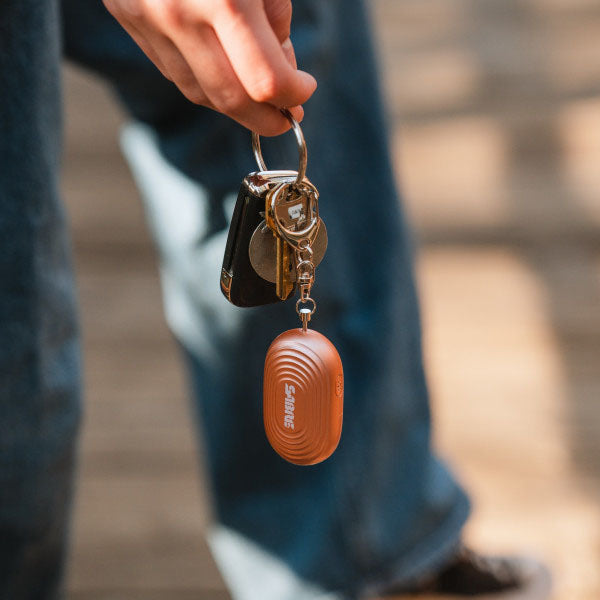 Schrillalarm 2-in-1 Personal Alarm mit LED Licht & Karabinerhaken, bronze